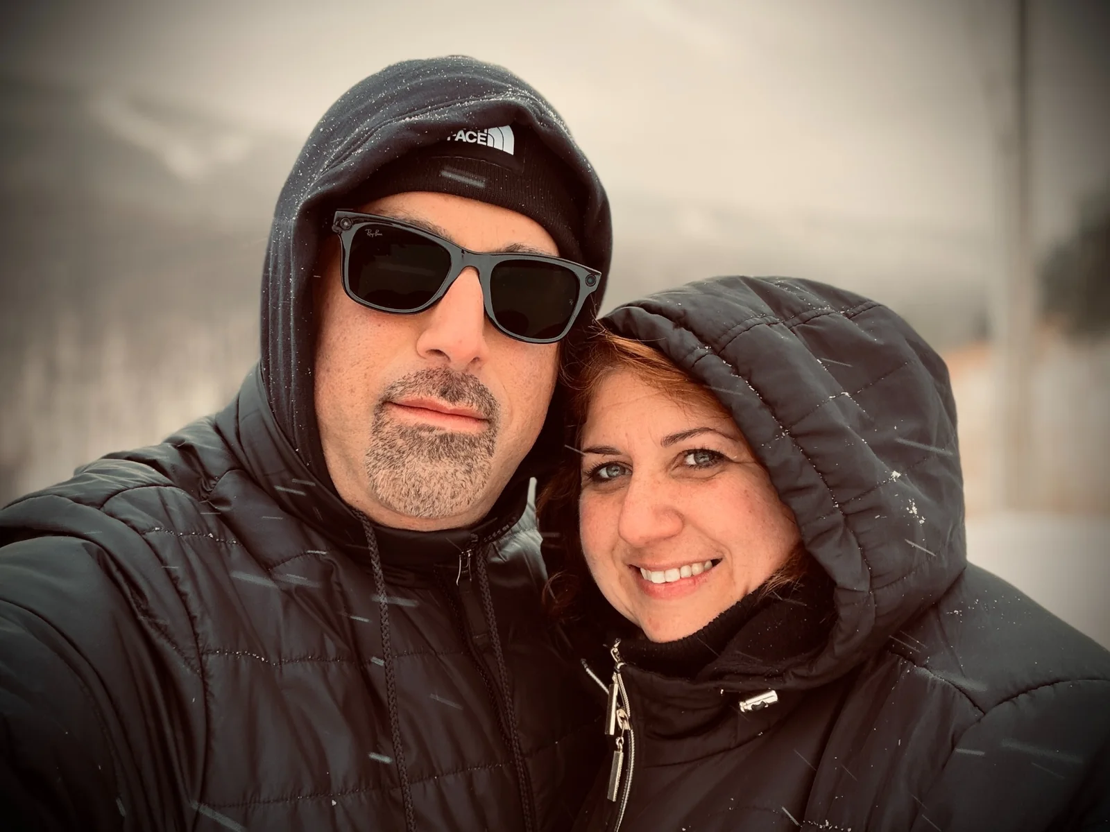 Nicole Mendys and Jay Urbaniak smiling during an evening out